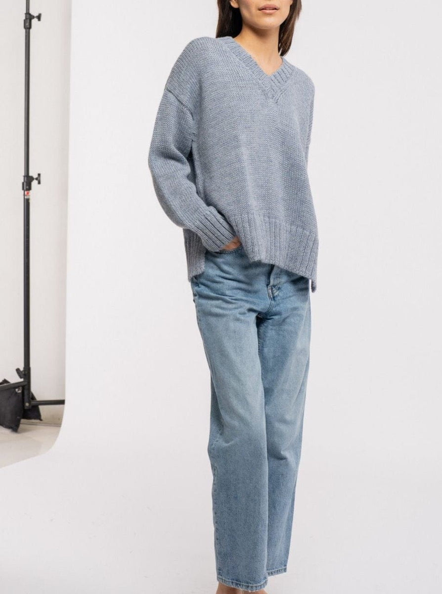 The model is wearing a Billy Sweater - Dusty Blue with ribbed trims.