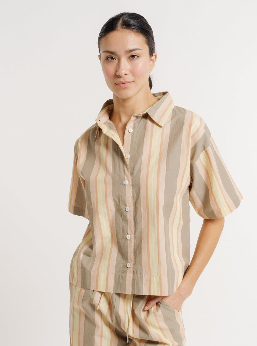 Woman in a Boxy Short Sleeve Button Up - Sorbet Stripe - Sample posing against a neutral background.