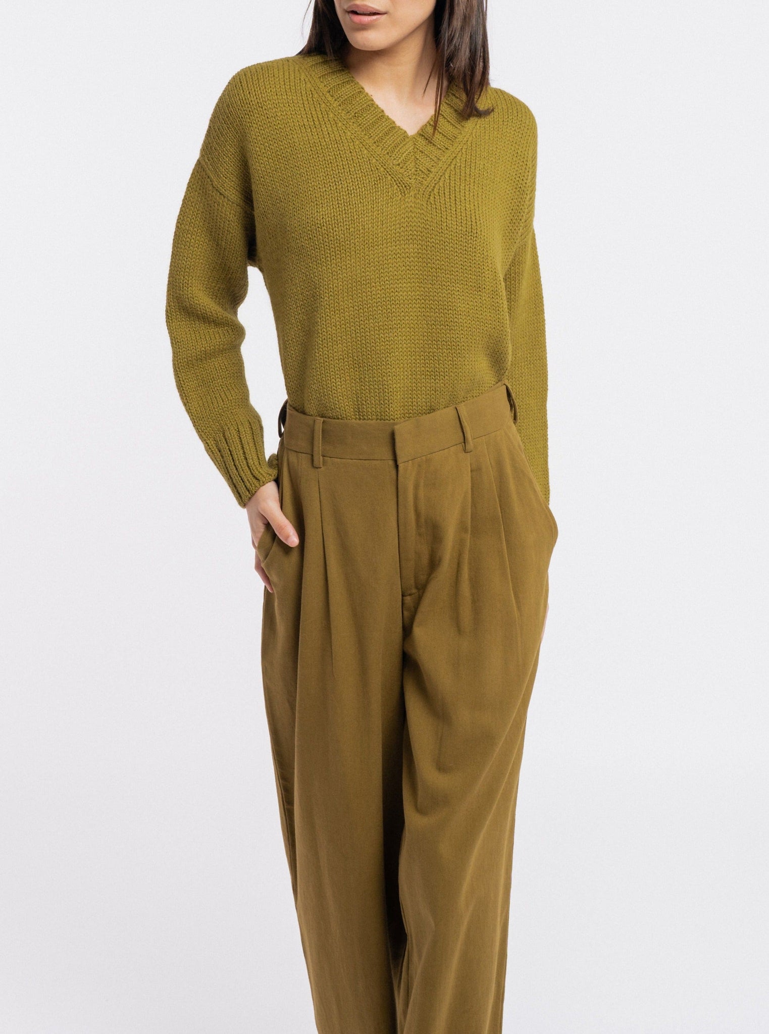 The model is wearing comfortable wide leg Alfred Trouser - Olive.
