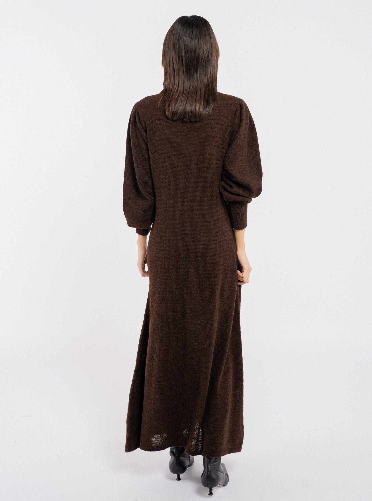 The back view of a woman wearing an Ennis Dress - Mustang Brown.