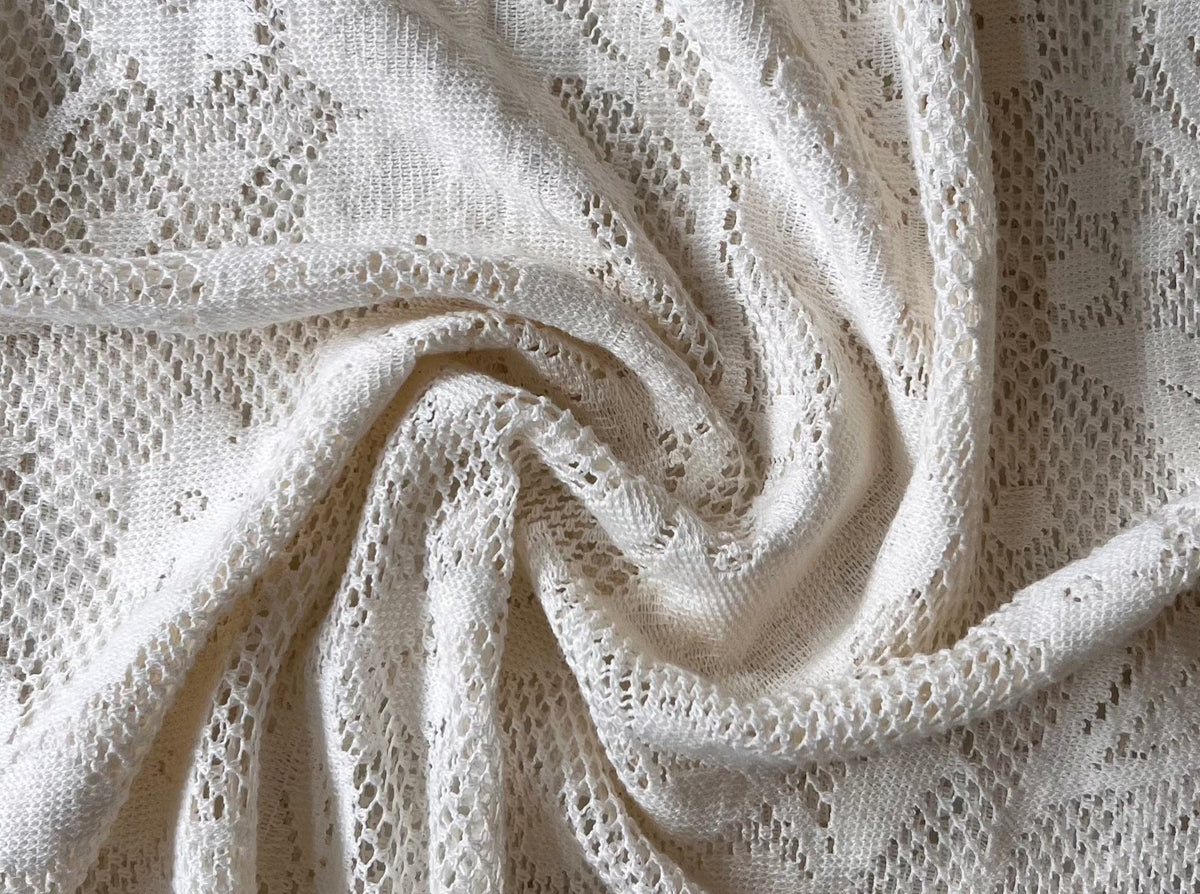 A close up image of the Ailes Dress - Ivory - Sample in like-new condition.