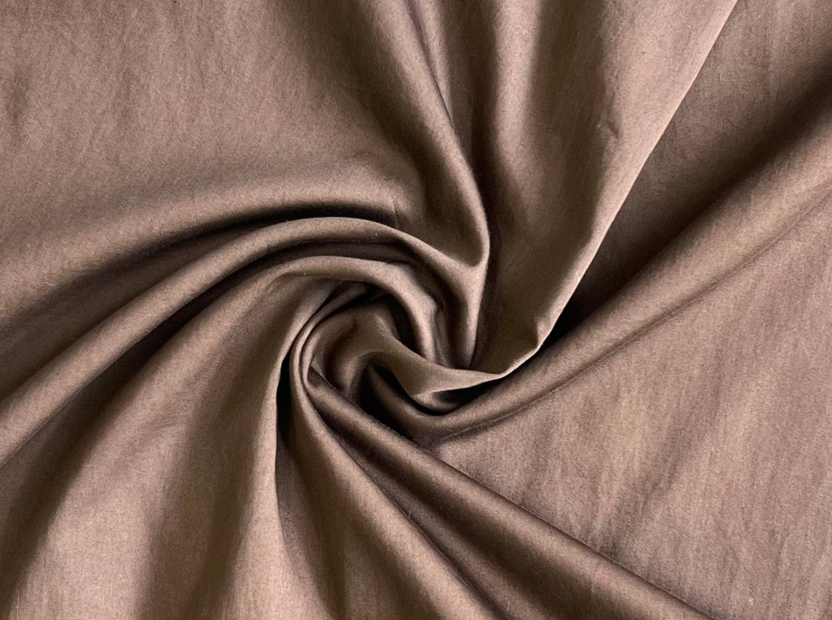 A close up of Dolores Dress - Balsalt Brown - Sample, handmade organic cotton fabric.