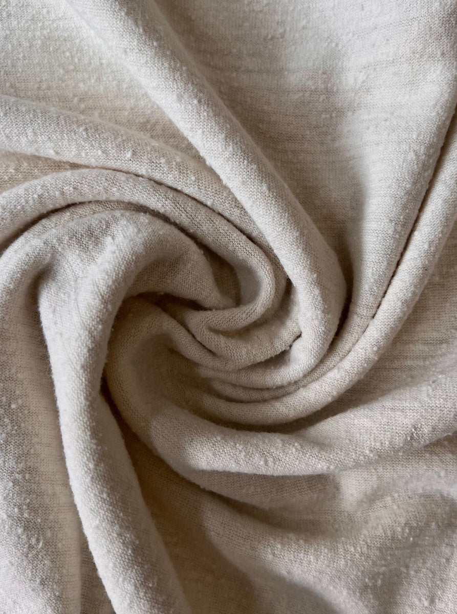A close up of a Baby Tee - Ivory fabric.