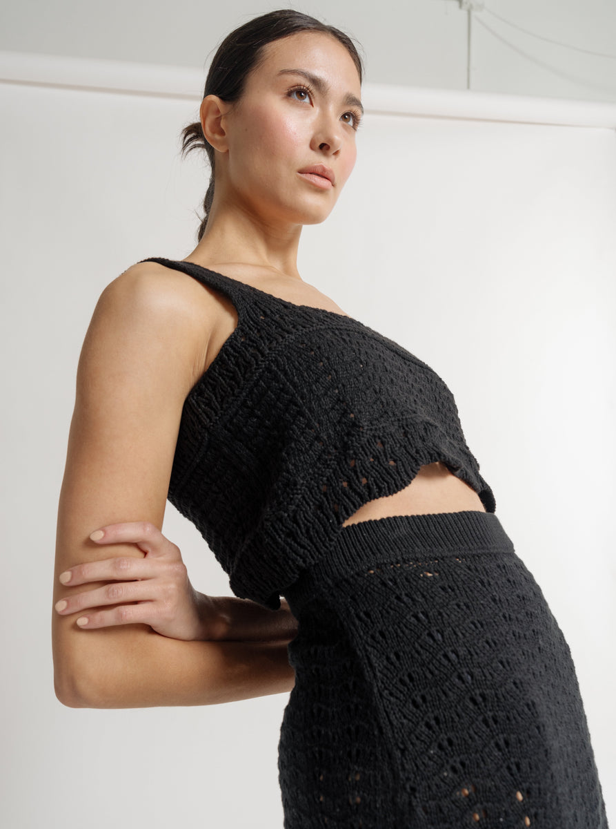 The model is wearing a black crochet Lyric Crochet Crop Tank - Black - Pre-order and skirt.