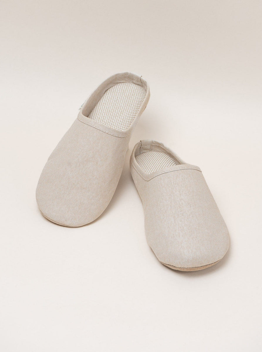 A pair of breathable white Sasawashi Room Shoes made from Sasawashi fabric, placed on a white surface.