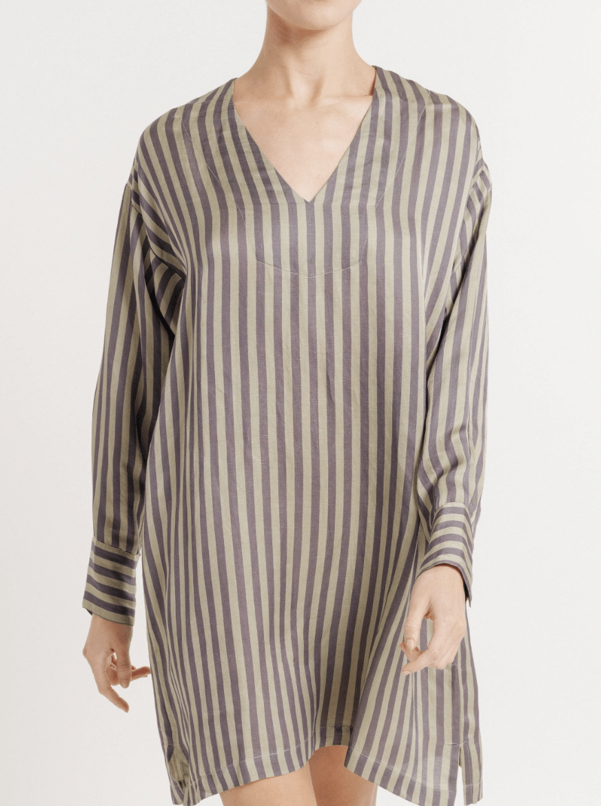 A person wearing a Modern Mini Tunic Dress in Putty/Slate Stripe with long sleeves against a light background, posing for a photoshoot sample.