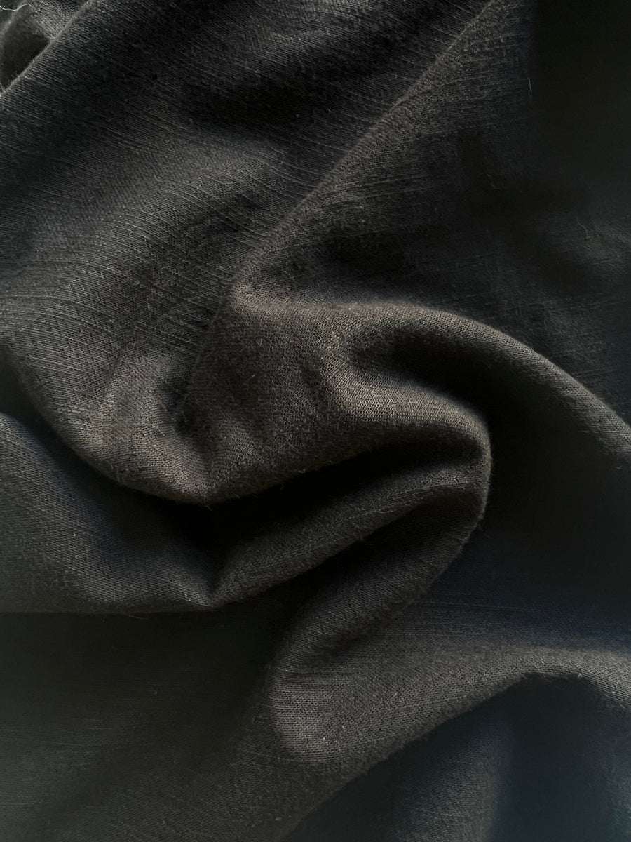 A close up image of an Everyday Top - Black fabric.