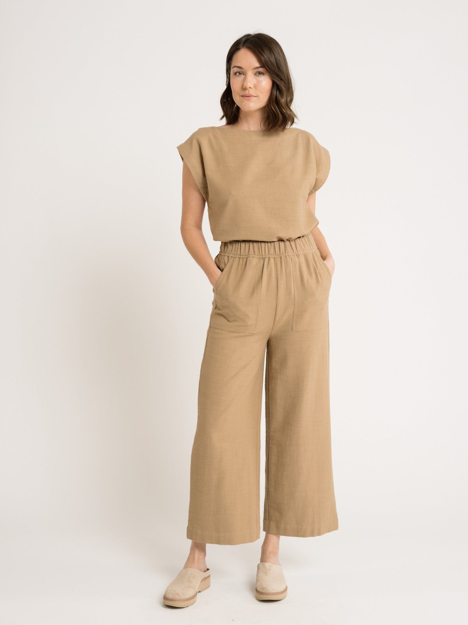 A model wearing a certified organic cotton Everyday Top - Tannin jumpsuit.