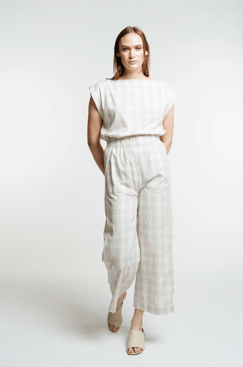The model is wearing the Everyday Crop Pant - Rivera Plaid.