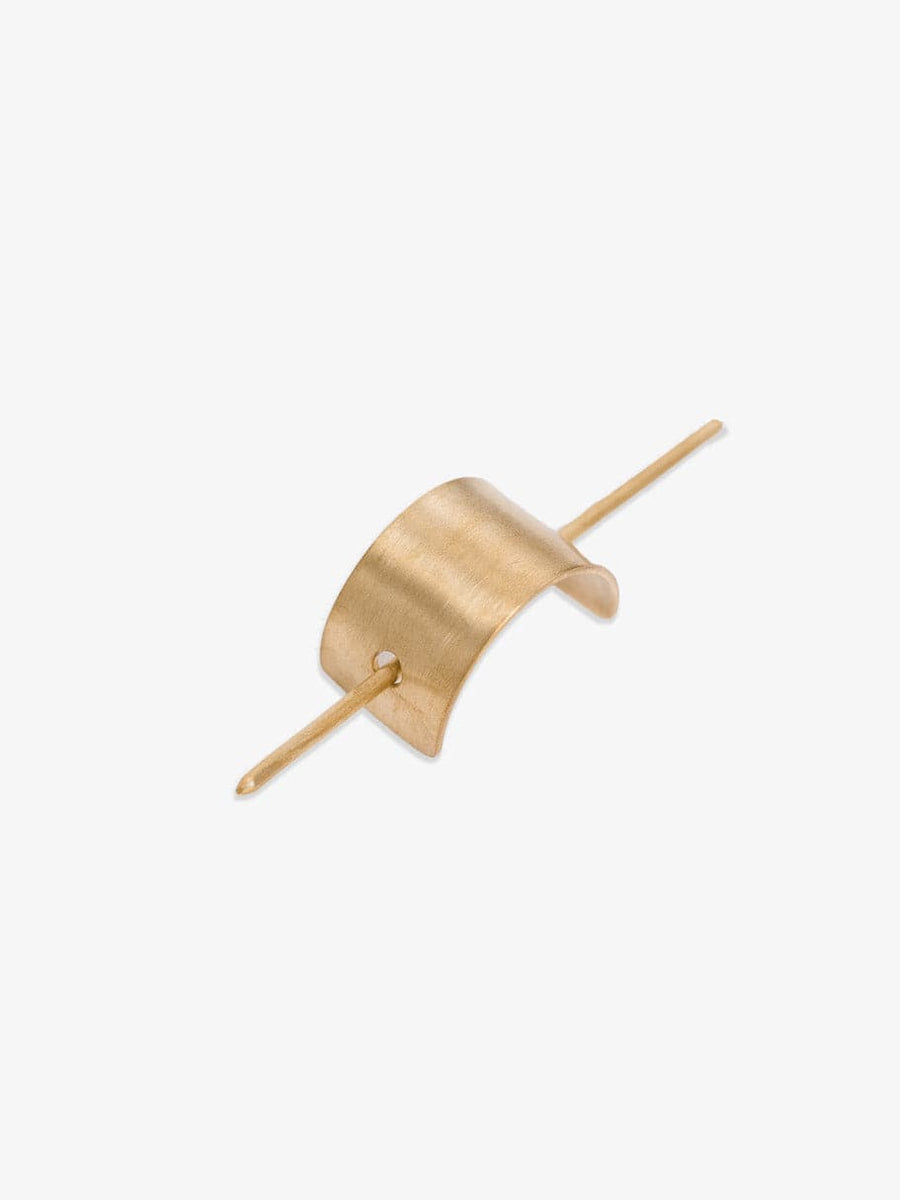 A gold plated hair pin with a curved shape and brushed arch.