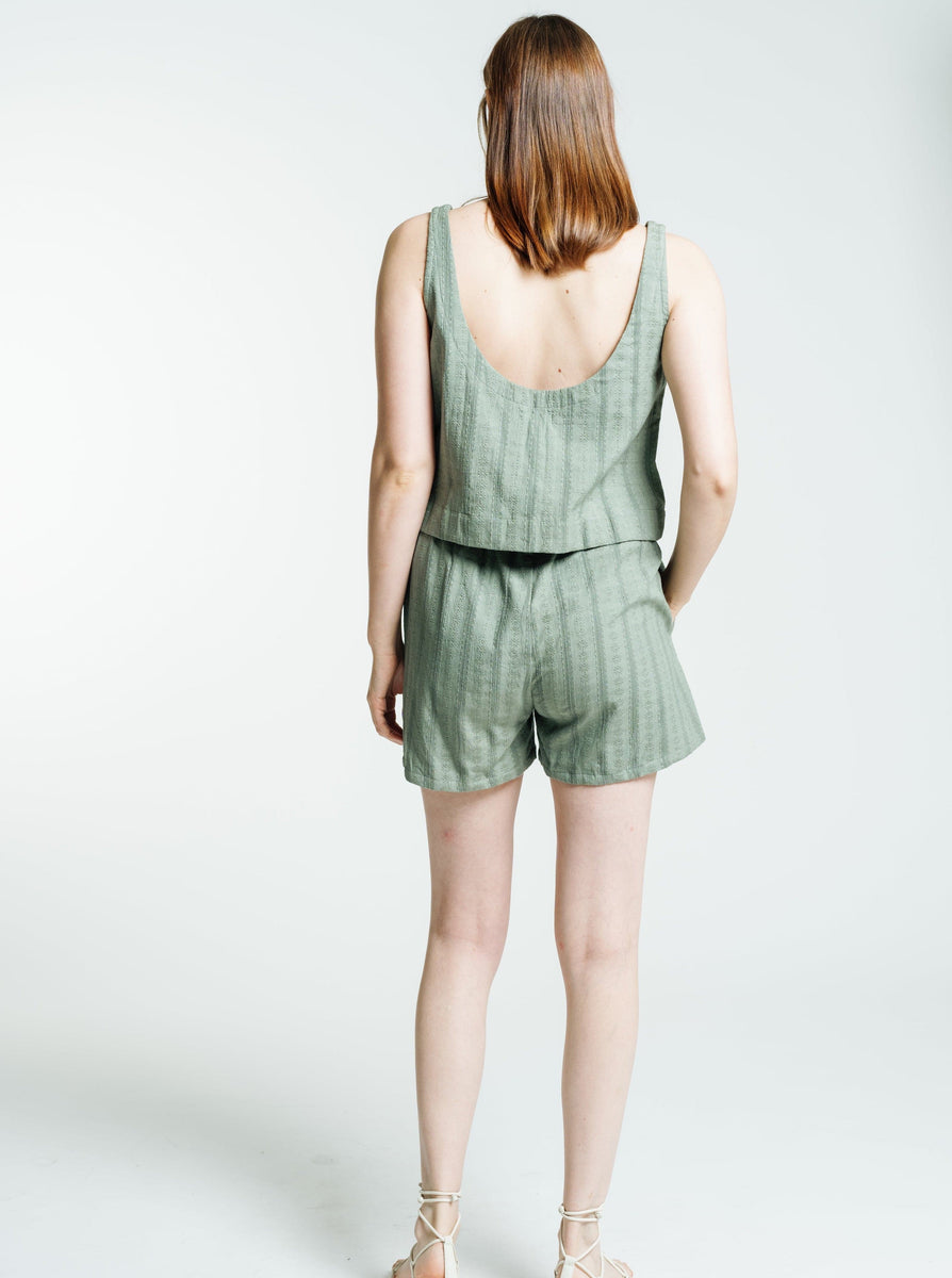 The back view of a woman wearing the Everyday Short - Azure Broderie.