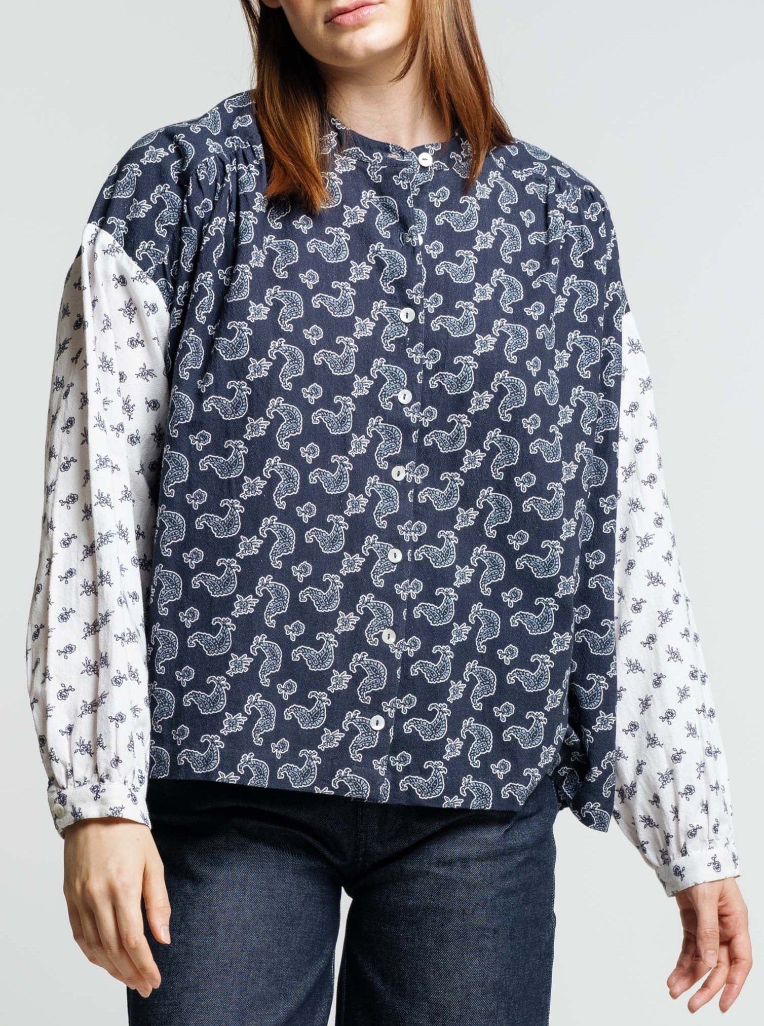The Francoise Top - Indigo Paisley Block is a 70s style organic crimp cotton shirt with a vibrant blue and white paisley pattern.