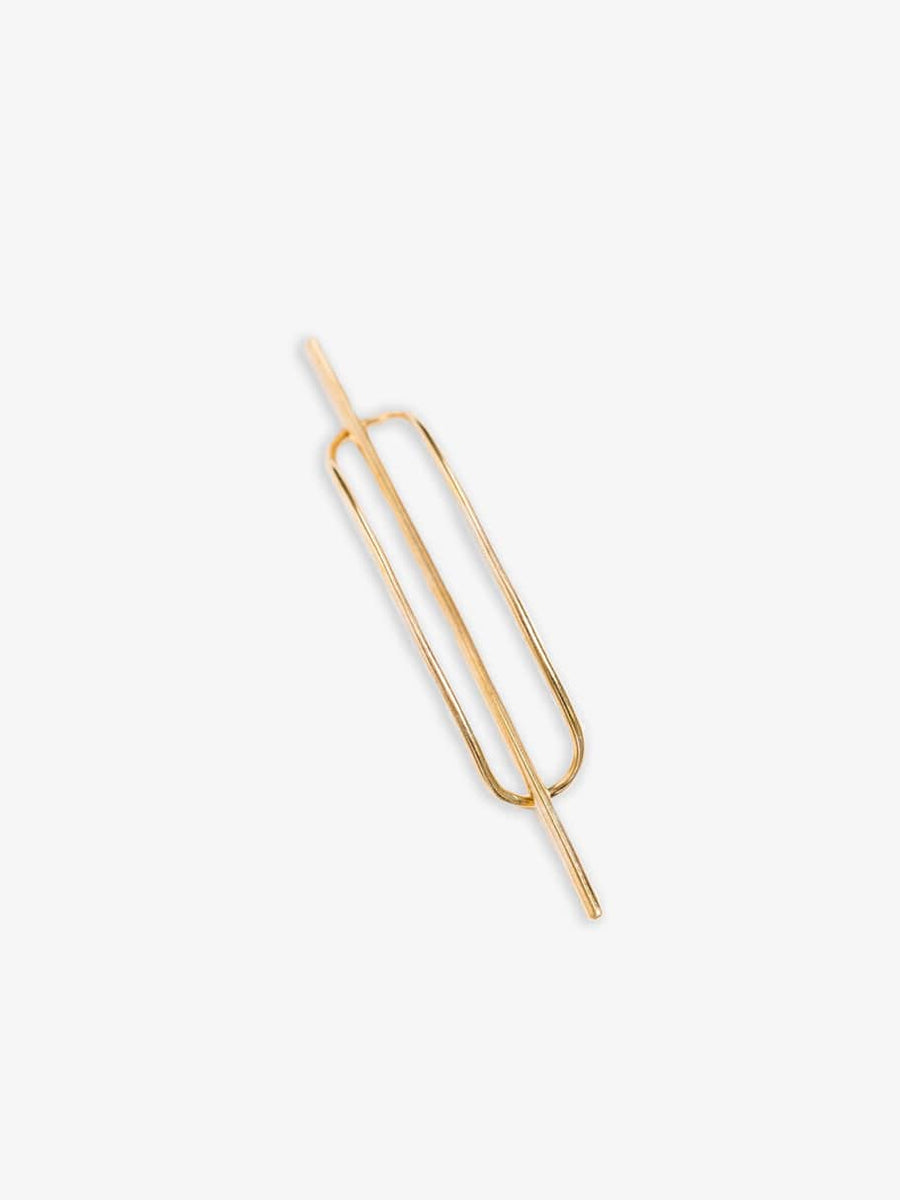 A Petite Oval Hair Pin - pre-order on a white surface.